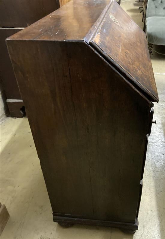 A mid 18th century oak bureau with well, width 92cm, depth 46cm, height 99cm